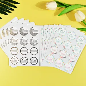 Decorative Eid and Ramadan sticker sheets with gold moon and floral wreath patterns