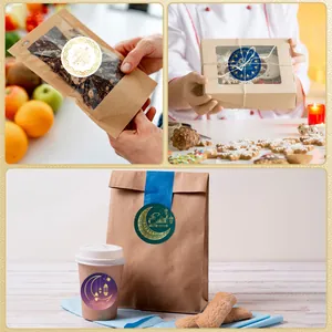 Detailed macro view of Middle Eastern moon gold foil stickers on various gift packaging