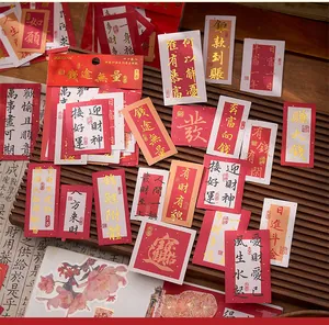 Detailweergave van goudgestempelde Chinese kalligrafie stickers voor DIY en plakboek