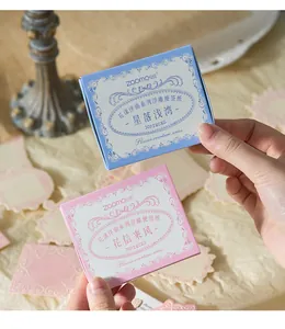 Hands holding romantic floral overture series relief memo paper boxes for scrapbooking