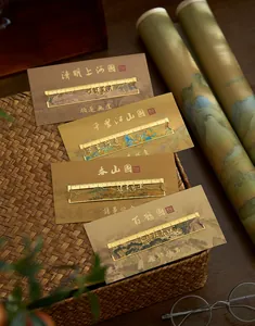 Detailed view of Chinese style hollowed metal bookmarks with landscape art and rulers