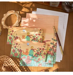 Close-up of artistic Little Prince theme stationery envelopes and writing sheets