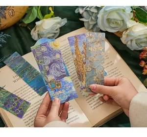 Detail view of gold-foiled PVC bookmarks featuring Van Gogh style oil painting designs.
