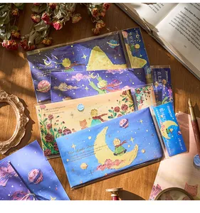 Detail view of The Little Prince themed envelope sets with artistic star illustrations