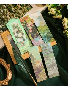 Detailed close-up of artistic PVC bookmarks with gold-stamped floral and landscape designs.