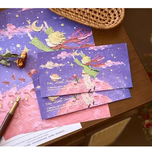 Macro view of oil-painting style Little Prince envelopes and cards with planet motifs