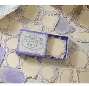 Close-up of retro embossed purple floral memo paper labels with various shapes