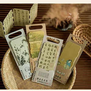 Close-up of vintage Chinese style paper bookmarks with traditional painting and calligraphy.