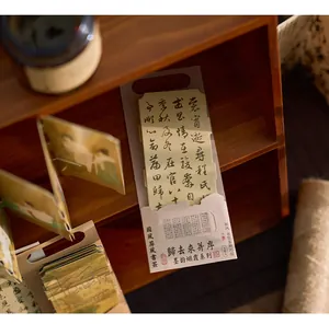 Detail shot of traditional Chinese style paper bookmarks in a wooden shelf setting