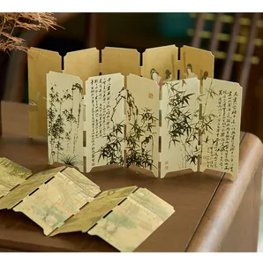 Detailed macro view of Chinese style folding bookmarks with bamboo ink wash painting