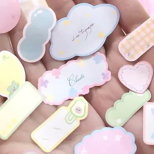 Cute pastel die-cut diary stickers in hands for journaling