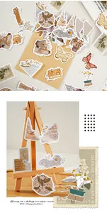 Detailed macro shot of vintage floral and butterfly stickers for DIY scrapbooking