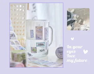 Close-up of cute Korean ins style purple washi tape stickers on a clear glass mug