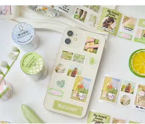 Green aesthetic ins style journal stickers decorated on a cream white smartphone case