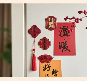 Close-up detail of traditional Chinese style resin fridge magnets with blessings and tassel