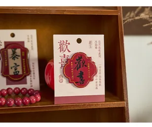Close-up of Chinese style resin fridge magnet with calligraphy text on display