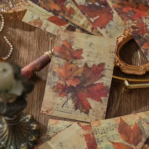 Vintage scrapbook paper featuring autumn maple leaves and retro music sheet designs