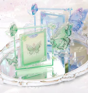 Detailed macro view of the butterfly-themed acrylic rotating card frame ornament.