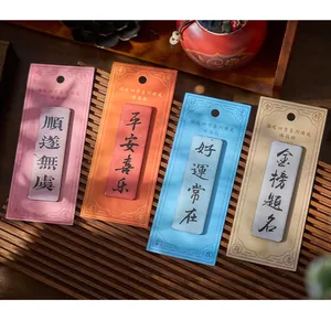 Detailed view of four colorful Chinese style fridge magnets with auspicious blessings.