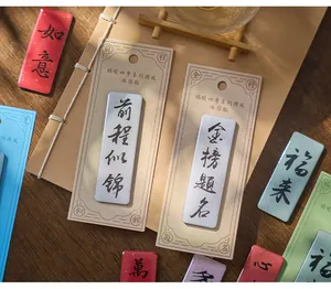 Close-up of Chinese style resin refrigerator magnets with traditional blessing calligraphy designs