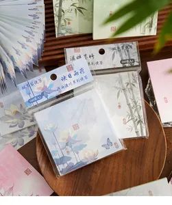 Detail view of ancient style floral memo pads with lotus and bamboo patterns
