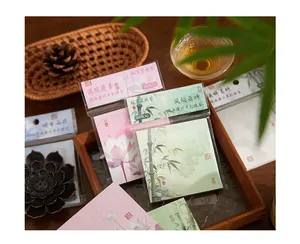 Traditional Chinese style vintage floral and bamboo memo pads set on a wooden tray