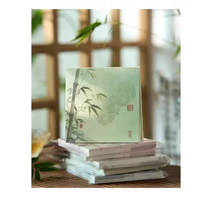 Stack of vintage Chinese style memo pads featuring elegant bamboo and calligraphy design
