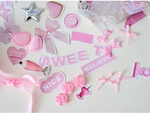 Close-up of pink bow ribbons and cute stickers for DIY ita bag decoration