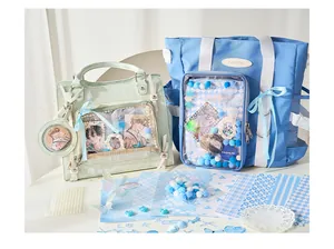 Comprehensive DIY ita bag material kit showing clear pocket bags, decorative papers, and badges