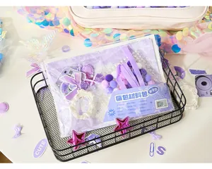 Detailed view of purple DIY Ita-bag kit with ribbons, pearls, and stickers