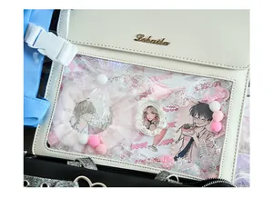 Close-up view of a DIY ita bag material kit featuring lace ribbons and cute anime character cards