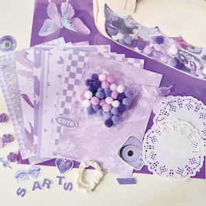 Purple themed DIY ita bag decoration kit with stickers, pom poms and lace paper