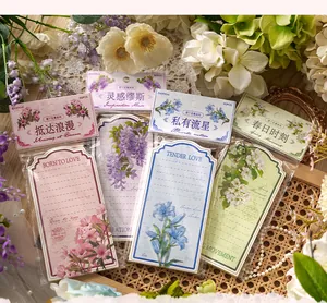 Detailed close-up of artistic floral memo pads with intricate botanical illustrations