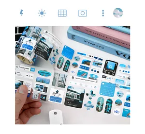 Close-up of blue aesthetic journaling sticker tape with clouds and music player design