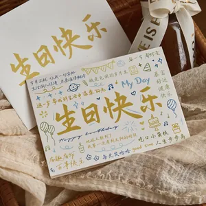 Birthday greeting card set with gold Happy Birthday lettering and matching envelope