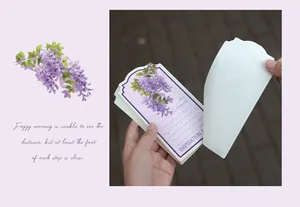 Detailed view of wisteria floral notepad showing paper texture and page peeling action.