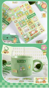 Detailed view of cute cartoon animal stickers decorated on a green ceramic coffee mug