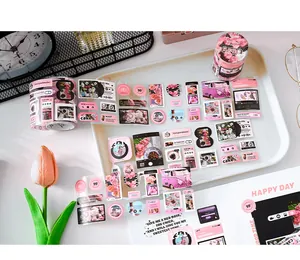 Close-up detail of pink and black aesthetic Korean style stickers for scrapbooking project