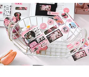 Close-up of pink romantic floral themed scrapbooking sticker set in a white basket