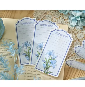 Artistic floral memo pad sheets with Tender Love text and blue lily illustration
