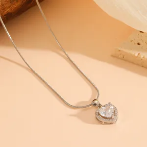 Detailed close-up view of silver heart pendant necklace with shimmering crystal halo
