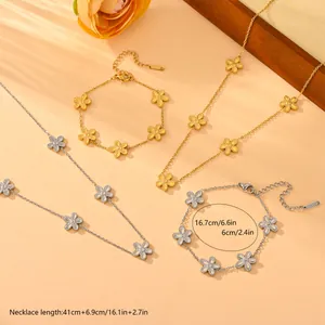 Elegant stainless steel daisy flower jewelry set featuring gold and silver necklaces and bracelets