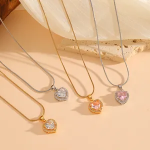 Detailed view of multiple heart-shaped crystal necklaces in gold and silver finishes