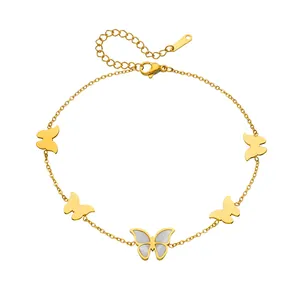Detailed view of a gold-plated stainless steel butterfly anklet with white shell inlay