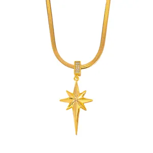 Detail view of a gold-plated stainless steel necklace featuring a rhinestone star pendant