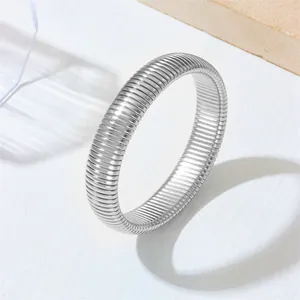Modern silver stainless steel elastic bangle featuring a minimalist ribbed stripe texture design