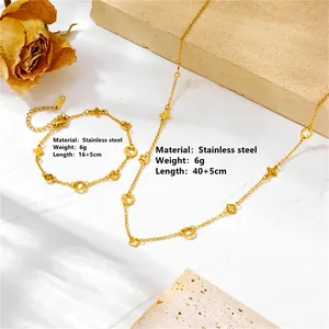 Elegant stainless steel gold clover jewelry set including hollow necklace and bracelet