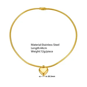 Detailed view of gold stainless steel snake bone necklace with heart pendant measurements