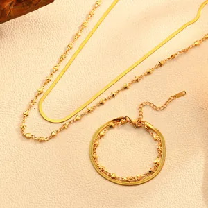 Ensemble collier et bracelet double couche en acier inoxydable, bijoux de mode dorés.