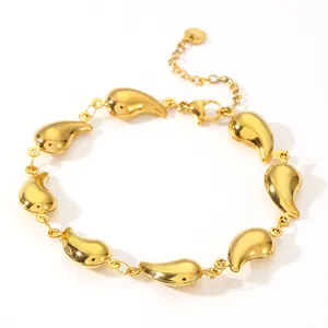 Close-up view of a minimalist gold-plated teardrop stainless steel link bracelet